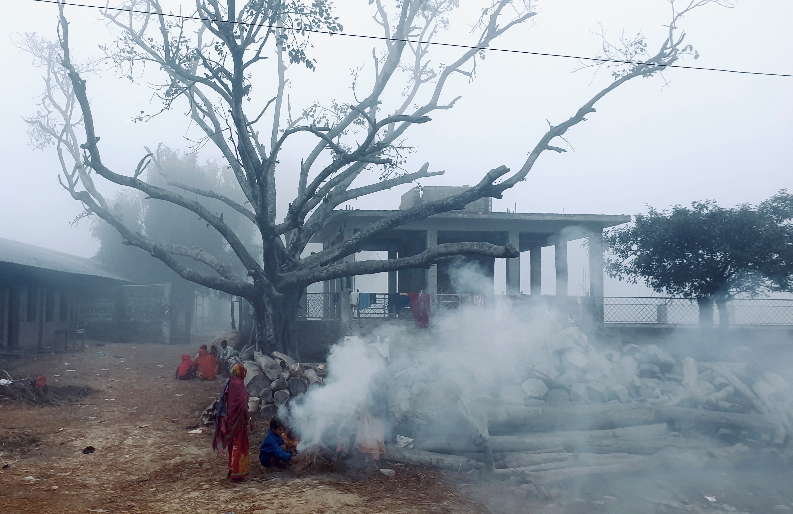 While the flames were already over and done with and churning out only smoke, those looking for warmth during this chilly morning in Parwaha, Dhanusa cheered up even at the sight of fumes!